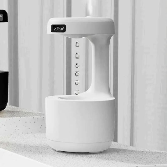 White electronic device with digital display on a light gray surface