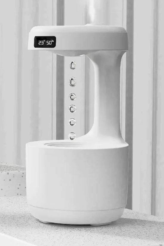 White electronic device with digital display on a light gray surface