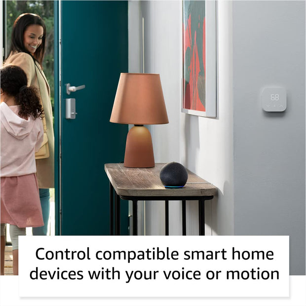 Alaxe Mini Bluetooth Speaker on wooden table in modern home hallway with smart device control features