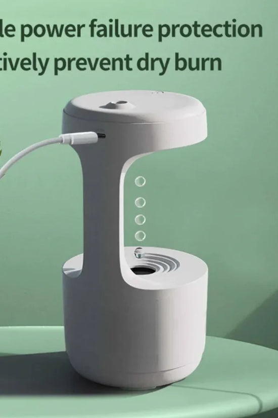 White humidifier with text about double power failure protection on a green background