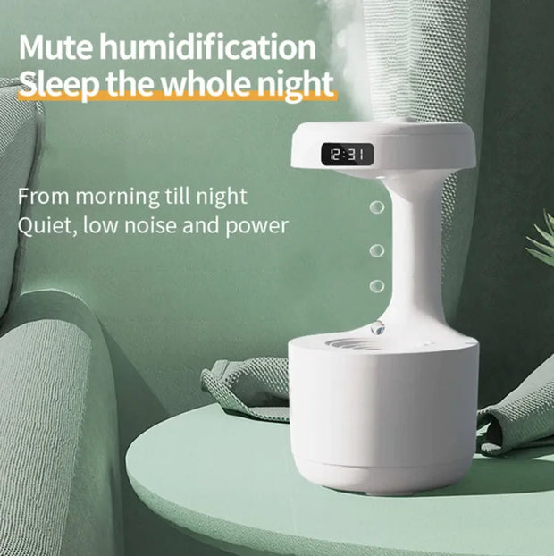 White humidifier on a green surface with text highlighting its features
