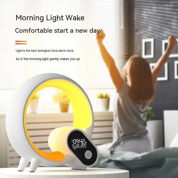 Sunrise alarm clock with gentle wake-up light and Bluetooth speaker on bedside table with woman stretching in background