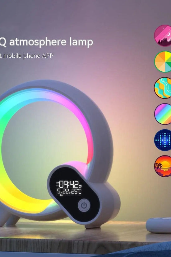 Sunrise alarm clock with Bluetooth speaker and colorful mood lighting on wooden table