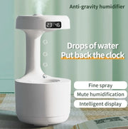 Anti-gravity humidifier with digital clock on a light green background